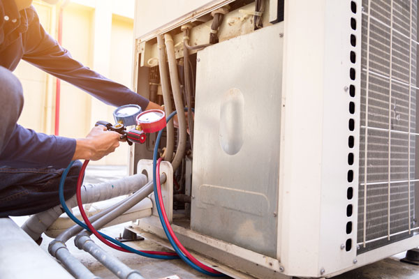 What are signs of air condenser refrigerant leaks?